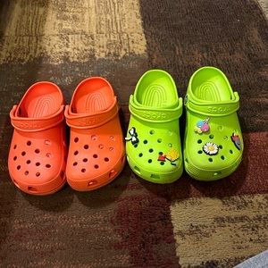 two pairs of crocs